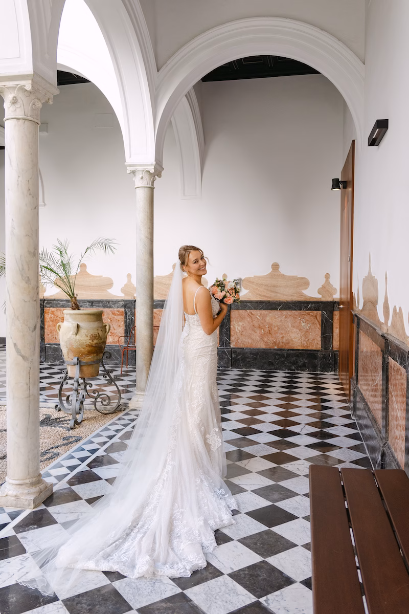 Bride standing courtyard seville intimate wedding spain
