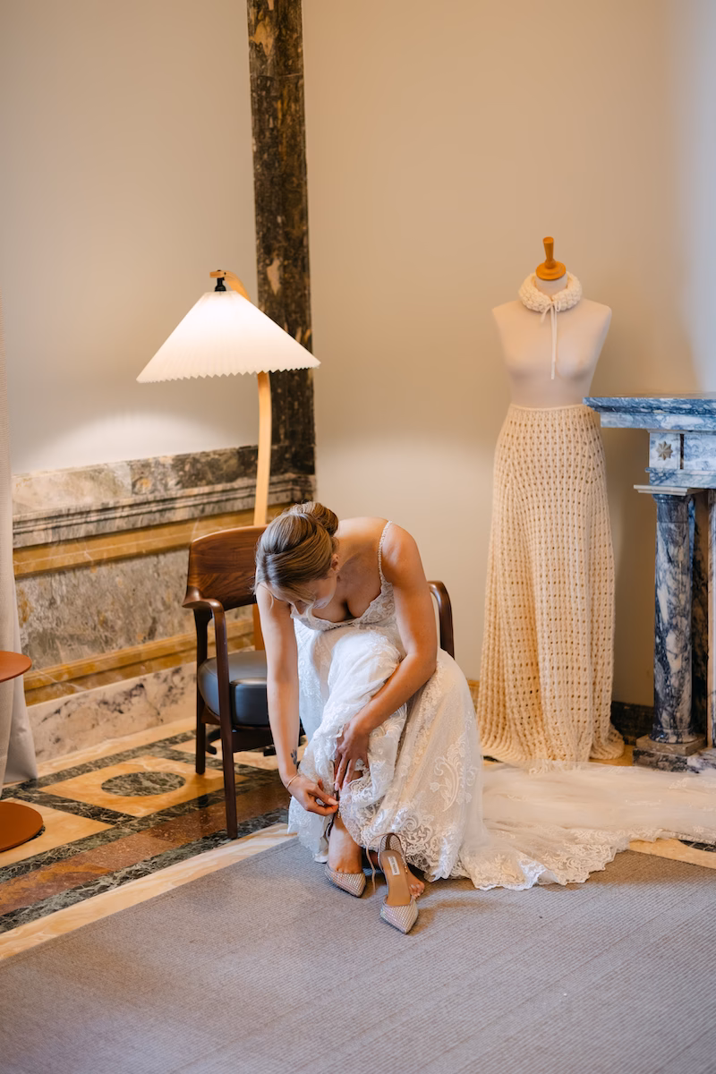 bride putting on shoes intimate wedding seville, spain. Intimate and romantic destination wedding in Seville