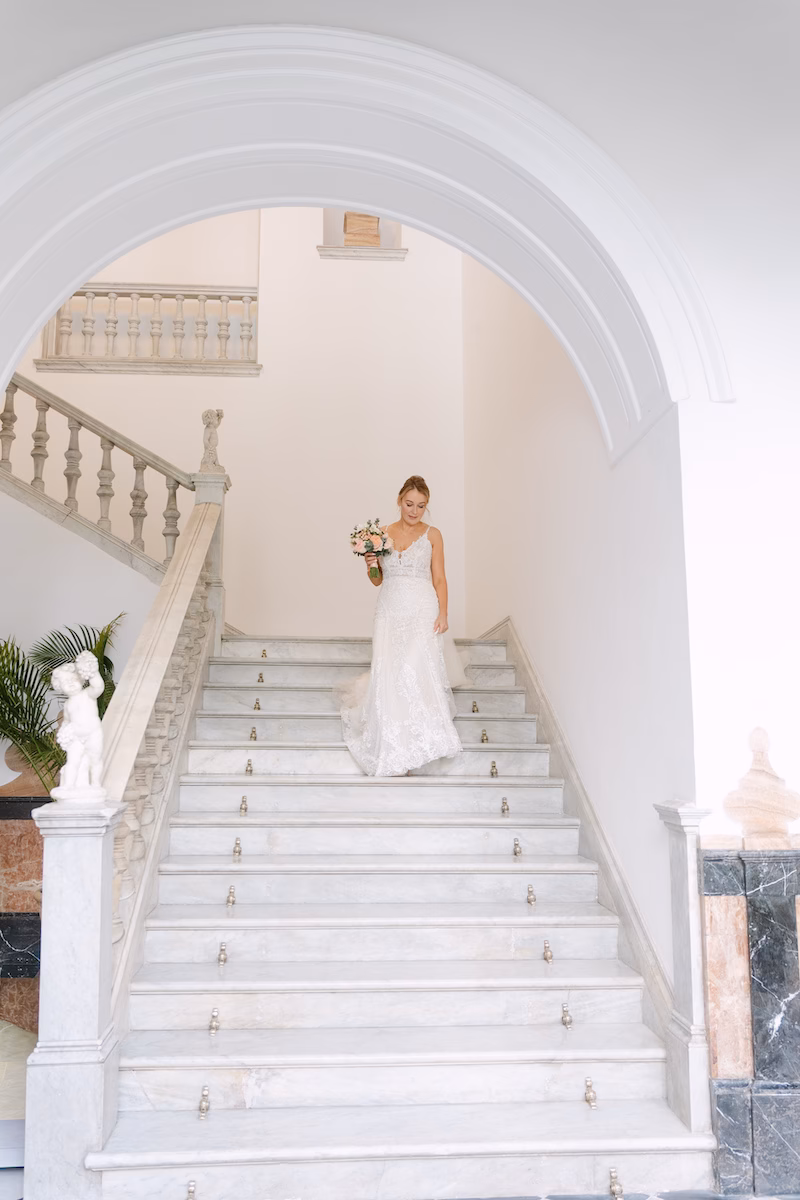bride walking down stairs seville wedding venue spain- Intimate and romantic destination wedding in Seville.