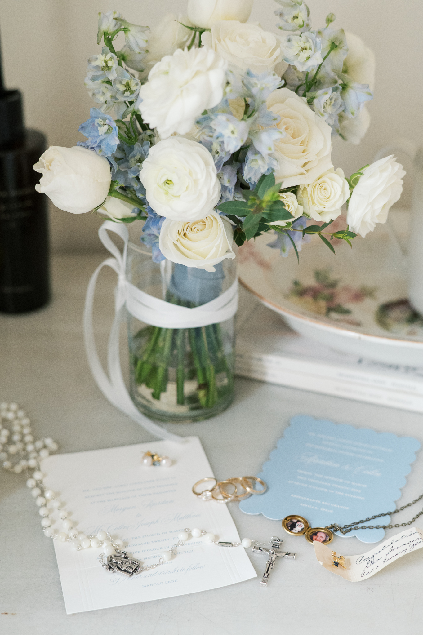 Catholic wedding details with rings and invitation from a destination wedding in Seville