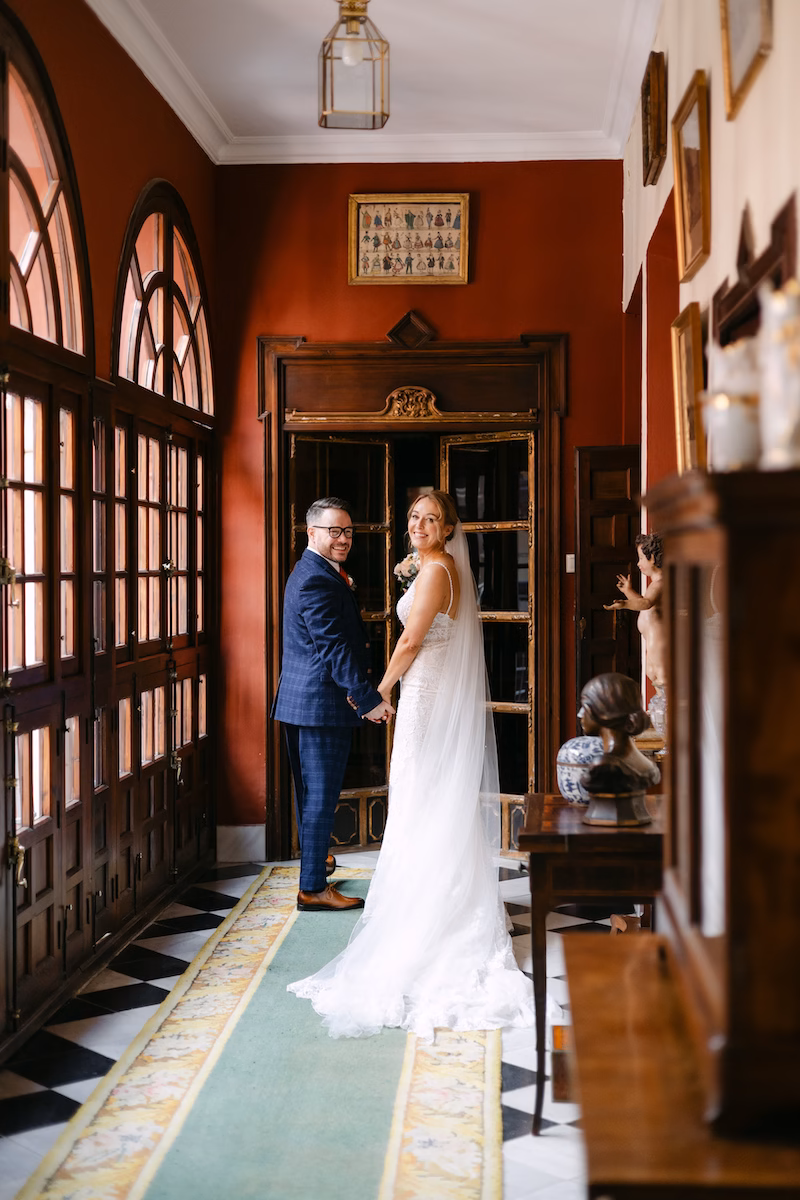 couple walking seville palace destination wedding spain