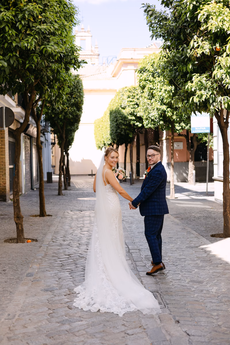 couple walking seville streets wedding spain- Intimate and romantic destination wedding in Seville.