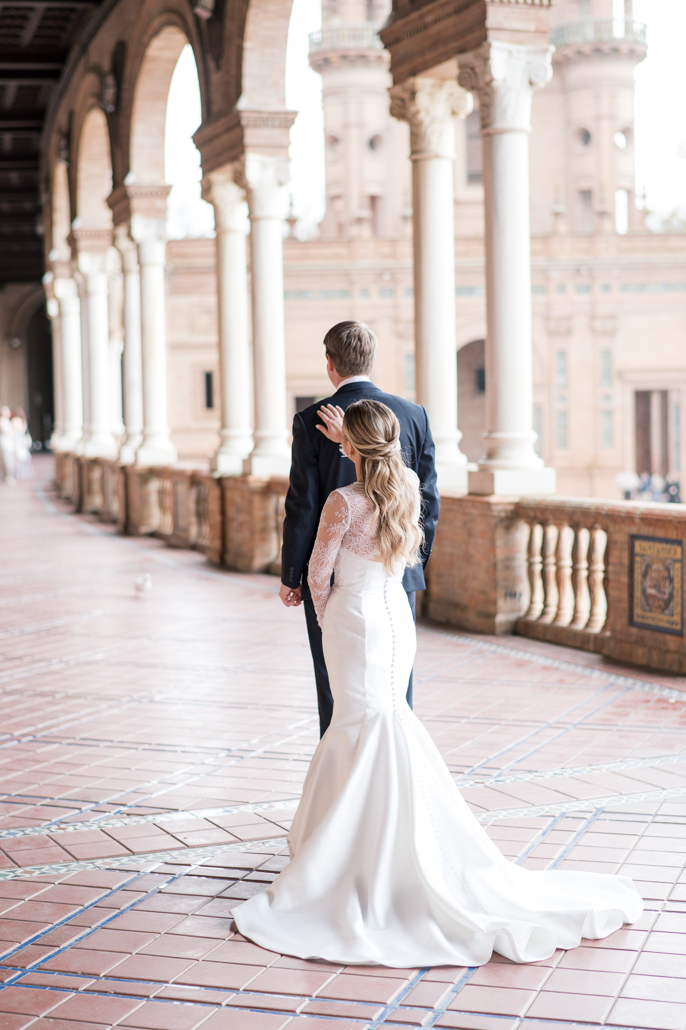 Emotional first look at Plaza de España during intimate destination wedding in Seville Spain