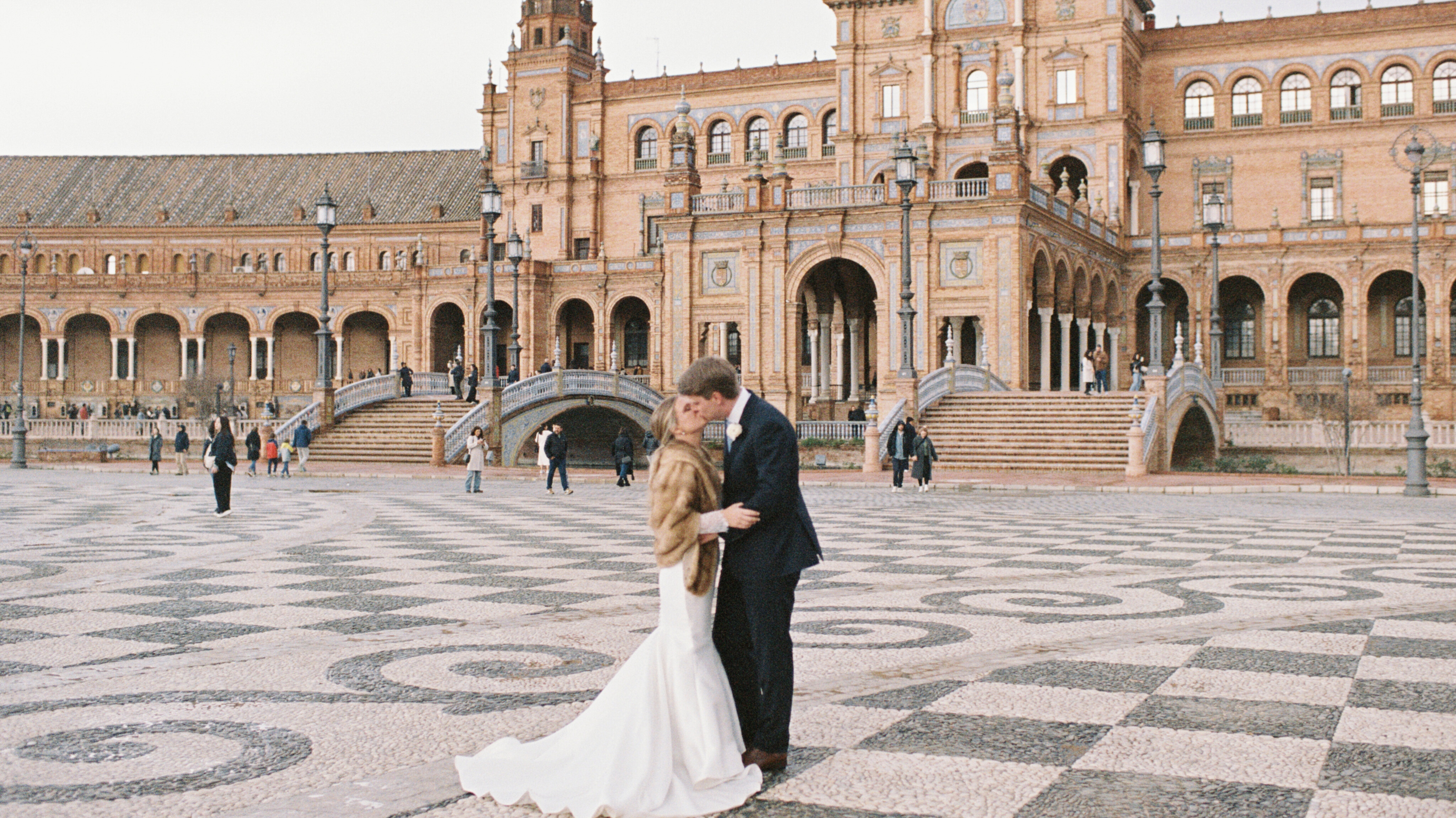 Intimate religious destination wedding in Seville at Plaza de España for an American couple